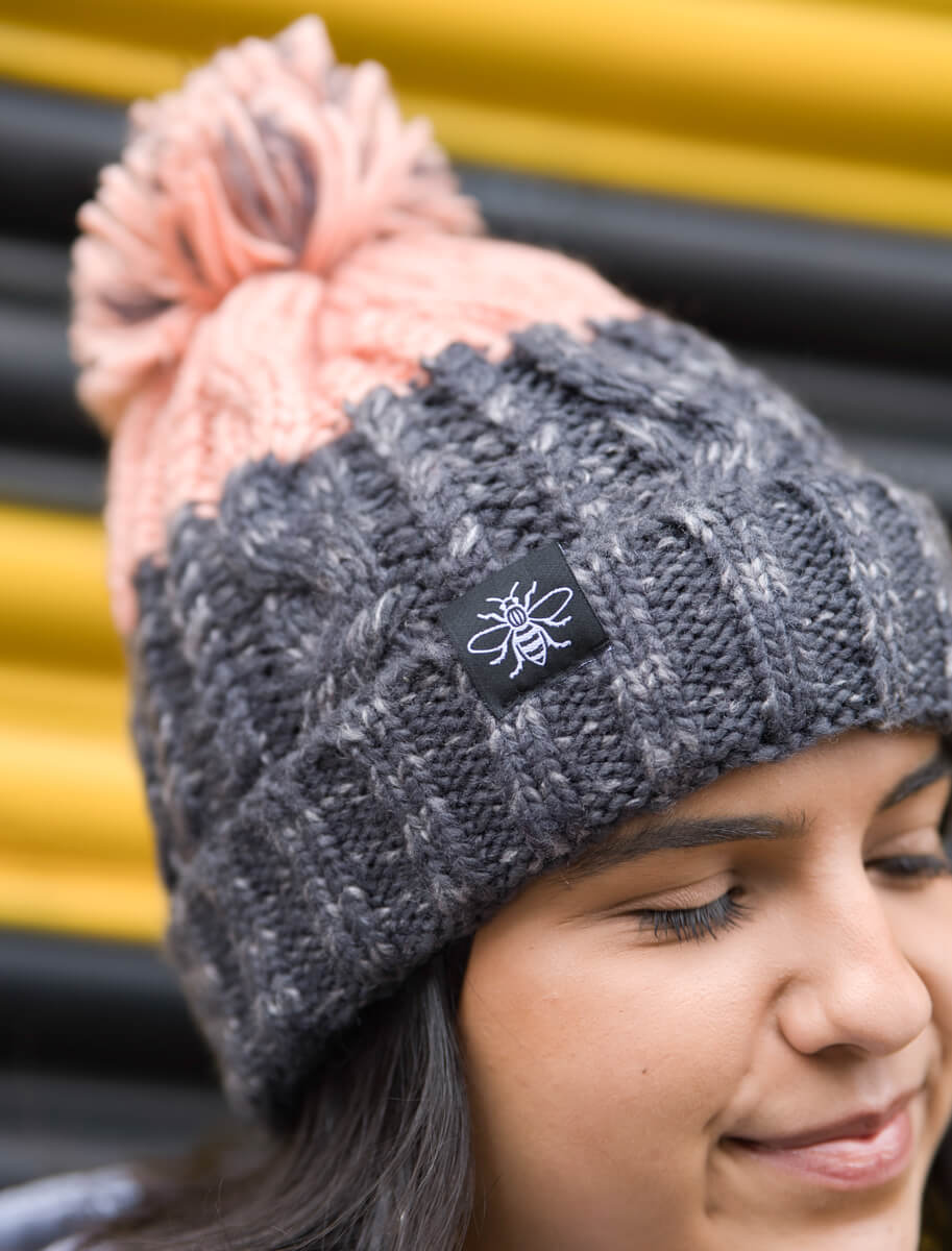 *Blush & Grey Chunky Knit Bee Beanie with Bobble (Staff) • The Manchester Shop
