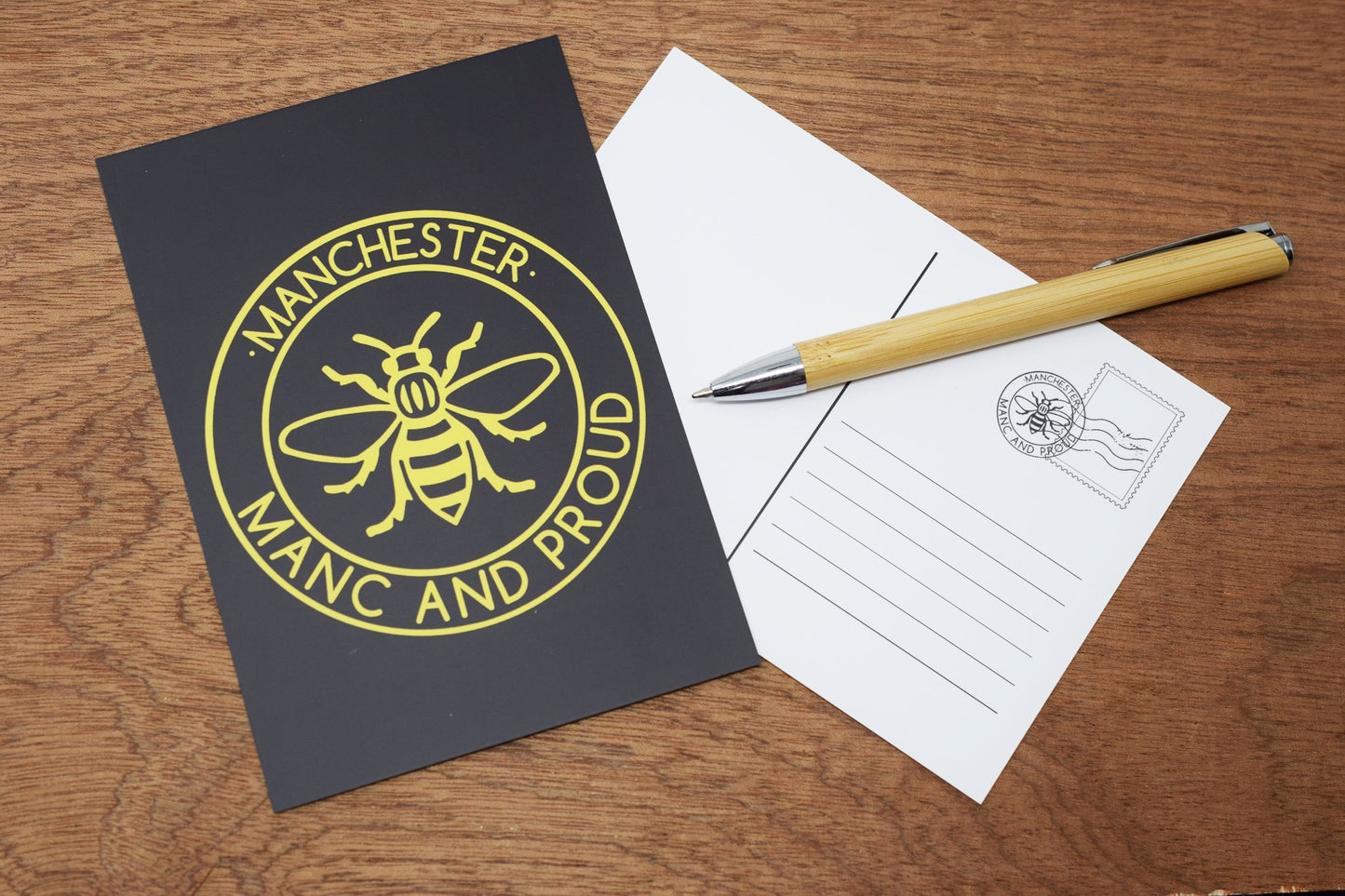 Manc & Proud Black and Yellow Postcard • The Manchester Shop